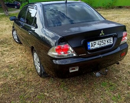 Чорний Міцубісі Lancer, об'ємом двигуна 1.6 л та пробігом 206 тис. км за 3400 $, фото 4 на Automoto.ua