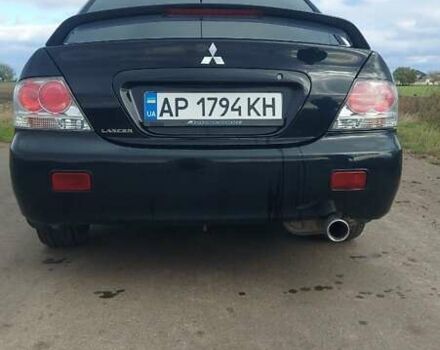 Черный Мицубиси Лансер, объемом двигателя 2 л и пробегом 225 тыс. км за 4400 $, фото 5 на Automoto.ua