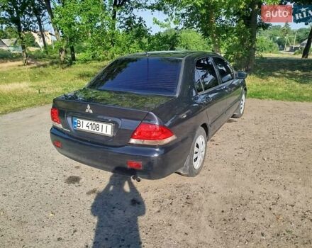 Чорний Міцубісі Lancer, об'ємом двигуна 1.6 л та пробігом 276 тис. км за 4000 $, фото 6 на Automoto.ua