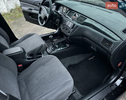 Черный Мицубиси Лансер, объемом двигателя 1.58 л и пробегом 154 тыс. км за 5500 $, фото 35 на Automoto.ua