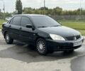 Черный Мицубиси Лансер, объемом двигателя 1.6 л и пробегом 390 тыс. км за 4000 $, фото 1 на Automoto.ua