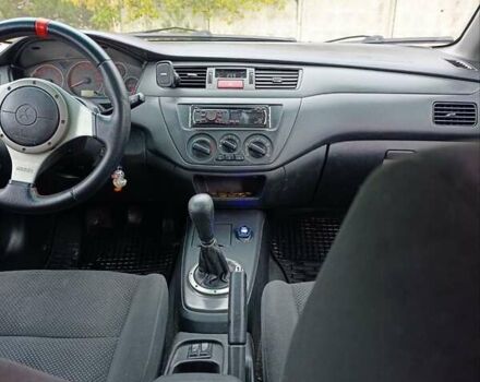 Черный Мицубиси Лансер, объемом двигателя 2 л и пробегом 225 тыс. км за 4400 $, фото 10 на Automoto.ua