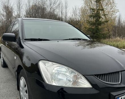 Черный Мицубиси Лансер, объемом двигателя 1.6 л и пробегом 200 тыс. км за 3500 $, фото 8 на Automoto.ua