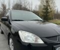 Черный Мицубиси Лансер, объемом двигателя 1.6 л и пробегом 200 тыс. км за 3500 $, фото 8 на Automoto.ua