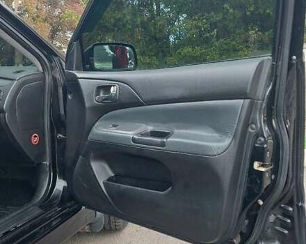 Черный Мицубиси Лансер, объемом двигателя 2 л и пробегом 225 тыс. км за 4400 $, фото 8 на Automoto.ua