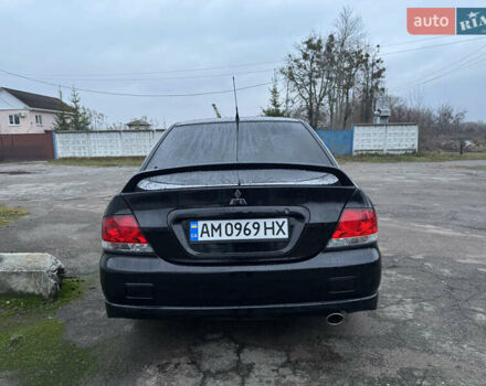 Черный Мицубиси Лансер, объемом двигателя 1.58 л и пробегом 154 тыс. км за 5500 $, фото 10 на Automoto.ua