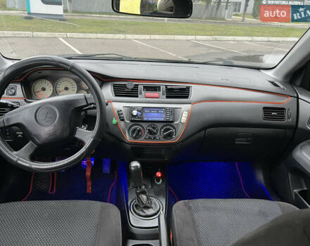 Черный Мицубиси Лансер, объемом двигателя 1.58 л и пробегом 300 тыс. км за 3850 $, фото 11 на Automoto.ua