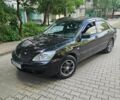 Черный Мицубиси Лансер, объемом двигателя 1.6 л и пробегом 250 тыс. км за 4702 $, фото 1 на Automoto.ua