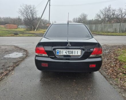 Черный Мицубиси Лансер, объемом двигателя 1.6 л и пробегом 280 тыс. км за 3200 $, фото 3 на Automoto.ua