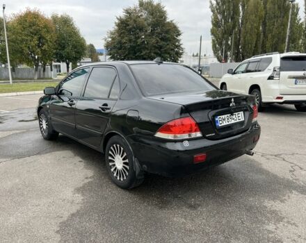 Черный Мицубиси Лансер, объемом двигателя 1.6 л и пробегом 390 тыс. км за 4000 $, фото 3 на Automoto.ua