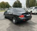 Черный Мицубиси Лансер, объемом двигателя 1.6 л и пробегом 390 тыс. км за 4000 $, фото 3 на Automoto.ua