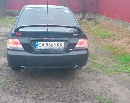 Черный Мицубиси Лансер, объемом двигателя 2 л и пробегом 270 тыс. км за 3200 $, фото 5 на Automoto.ua