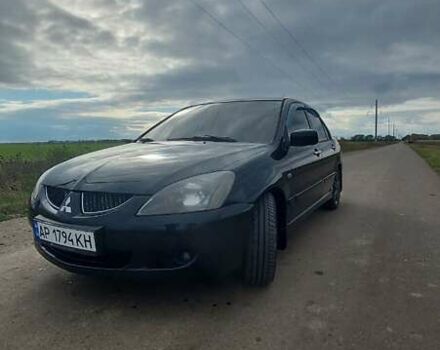 Черный Мицубиси Лансер, объемом двигателя 2 л и пробегом 225 тыс. км за 4400 $, фото 1 на Automoto.ua