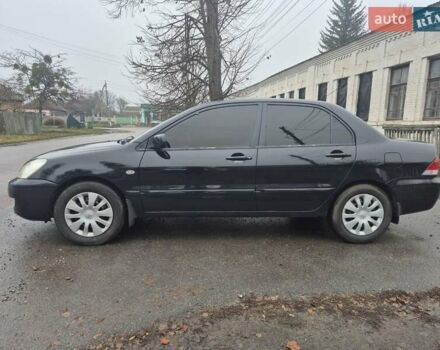 Черный Мицубиси Лансер, объемом двигателя 1.58 л и пробегом 280 тыс. км за 3200 $, фото 1 на Automoto.ua