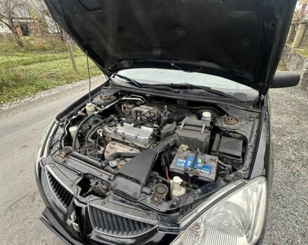 Черный Мицубиси Лансер, объемом двигателя 1.6 л и пробегом 200 тыс. км за 3500 $, фото 10 на Automoto.ua