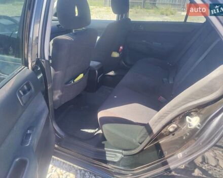 Чорний Міцубісі Lancer, об'ємом двигуна 1.58 л та пробігом 206 тис. км за 3600 $, фото 4 на Automoto.ua