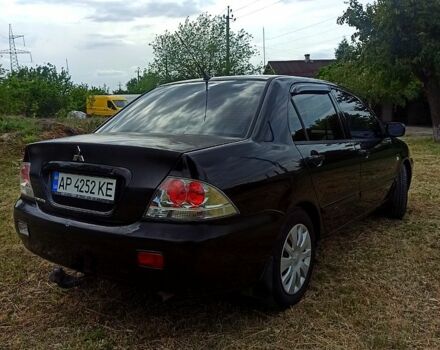 Чорний Міцубісі Lancer, об'ємом двигуна 1.6 л та пробігом 206 тис. км за 3400 $, фото 3 на Automoto.ua