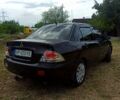 Чорний Міцубісі Lancer, об'ємом двигуна 1.6 л та пробігом 206 тис. км за 3400 $, фото 3 на Automoto.ua