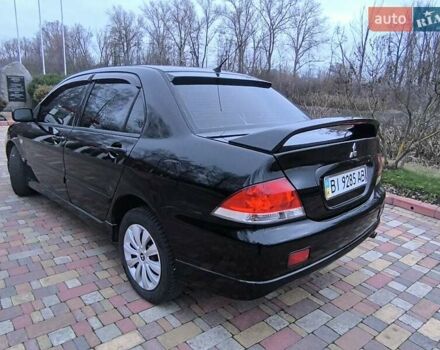 Чорний Міцубісі Lancer, об'ємом двигуна 1.58 л та пробігом 263 тис. км за 4500 $, фото 17 на Automoto.ua