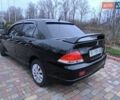 Чорний Міцубісі Lancer, об'ємом двигуна 1.58 л та пробігом 263 тис. км за 4500 $, фото 17 на Automoto.ua