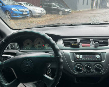 Черный Мицубиси Лансер, объемом двигателя 1.58 л и пробегом 264 тыс. км за 4600 $, фото 1 на Automoto.ua