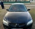 Чорний Міцубісі Lancer, об'ємом двигуна 2 л та пробігом 485 тис. км за 4500 $, фото 1 на Automoto.ua