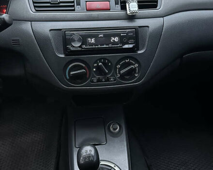Чорний Міцубісі Lancer, об'ємом двигуна 2 л та пробігом 250 тис. км за 3999 $, фото 9 на Automoto.ua
