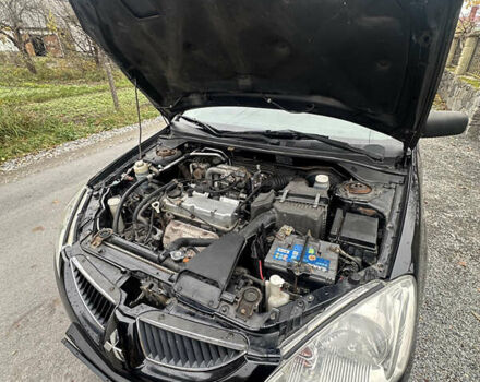 Черный Мицубиси Лансер, объемом двигателя 1.6 л и пробегом 200 тыс. км за 3499 $, фото 11 на Automoto.ua