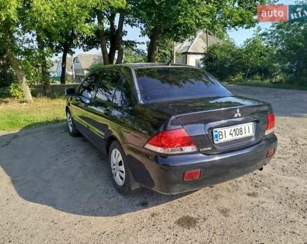 Чорний Міцубісі Lancer, об'ємом двигуна 1.6 л та пробігом 276 тис. км за 4000 $, фото 4 на Automoto.ua