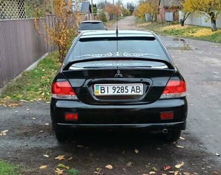 Черный Мицубиси Лансер, объемом двигателя 1.58 л и пробегом 261 тыс. км за 4400 $, фото 6 на Automoto.ua