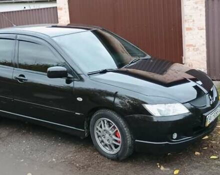 Черный Мицубиси Лансер, объемом двигателя 1.58 л и пробегом 261 тыс. км за 4400 $, фото 2 на Automoto.ua