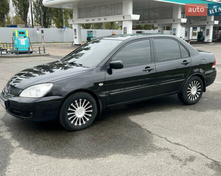 Черный Мицубиси Лансер, объемом двигателя 1.58 л и пробегом 300 тыс. км за 3850 $, фото 4 на Automoto.ua