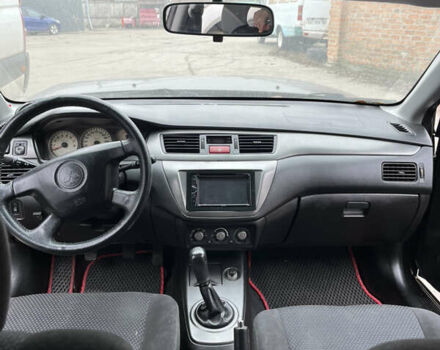Чорний Міцубісі Lancer, об'ємом двигуна 1.58 л та пробігом 360 тис. км за 1500 $, фото 9 на Automoto.ua