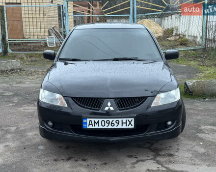 Черный Мицубиси Лансер, объемом двигателя 1.58 л и пробегом 154 тыс. км за 5500 $, фото 4 на Automoto.ua