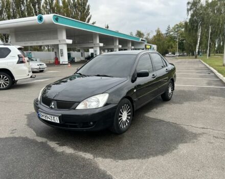 Черный Мицубиси Лансер, объемом двигателя 1.6 л и пробегом 390 тыс. км за 4000 $, фото 2 на Automoto.ua