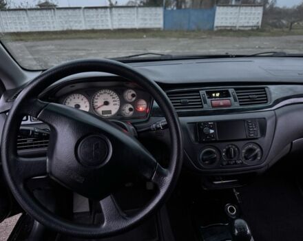 Чорний Міцубісі Lancer, об'ємом двигуна 1.6 л та пробігом 154 тис. км за 5500 $, фото 19 на Automoto.ua