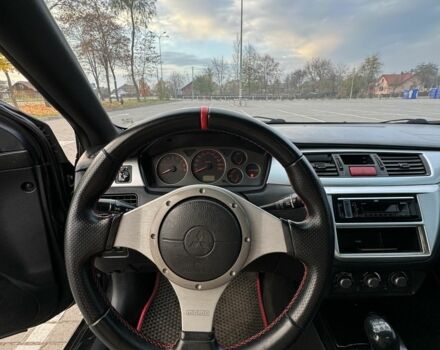 Черный Мицубиси Лансер, объемом двигателя 2 л и пробегом 270 тыс. км за 5200 $, фото 7 на Automoto.ua