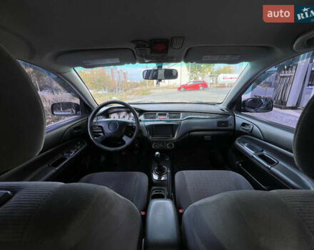 Чорний Міцубісі Lancer, об'ємом двигуна 1.58 л та пробігом 364 тис. км за 4000 $, фото 13 на Automoto.ua