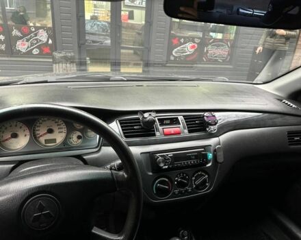 Мицубиси Лансер 2005 в Каменское - Днепродзержинск на Automoto.ua Черный Мицубиси Лансер, объемом двигателя 1.6 л и пробегом 280 тыс. км за 4500 $, фото 13 на Automoto.ua