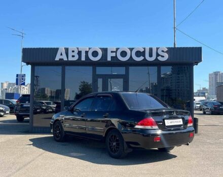 Чорний Міцубісі Lancer, об'ємом двигуна 2 л та пробігом 310 тис. км за 4990 $, фото 4 на Automoto.ua