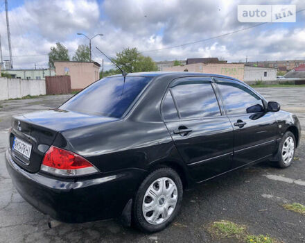 Чорний Міцубісі Lancer, об'ємом двигуна 1.58 л та пробігом 300 тис. км за 3799 $, фото 7 на Automoto.ua