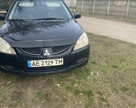 Чорний Міцубісі Lancer, об'ємом двигуна 1.58 л та пробігом 279 тис. км за 4000 $, фото 3 на Automoto.ua