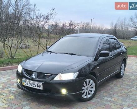 Чорний Міцубісі Lancer, об'ємом двигуна 1.58 л та пробігом 263 тис. км за 4500 $, фото 23 на Automoto.ua