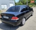 Черный Мицубиси Лансер, объемом двигателя 1.58 л и пробегом 352 тыс. км за 4000 $, фото 4 на Automoto.ua