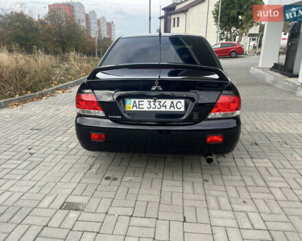 Чорний Міцубісі Lancer, об'ємом двигуна 1.58 л та пробігом 364 тис. км за 4000 $, фото 8 на Automoto.ua