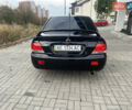 Чорний Міцубісі Lancer, об'ємом двигуна 1.58 л та пробігом 364 тис. км за 4000 $, фото 8 на Automoto.ua