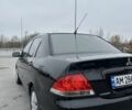 Черный Мицубиси Лансер, объемом двигателя 1.6 л и пробегом 200 тыс. км за 3500 $, фото 3 на Automoto.ua