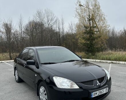 Черный Мицубиси Лансер, объемом двигателя 1.6 л и пробегом 200 тыс. км за 3500 $, фото 7 на Automoto.ua