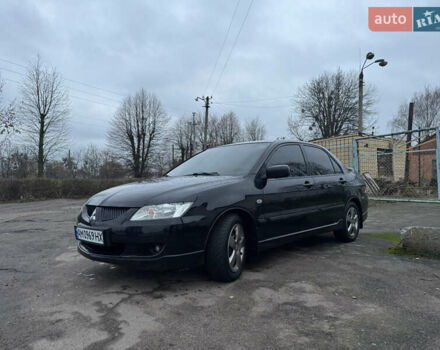 Черный Мицубиси Лансер, объемом двигателя 1.58 л и пробегом 154 тыс. км за 5500 $, фото 5 на Automoto.ua