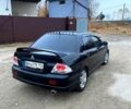 Черный Мицубиси Лансер, объемом двигателя 2 л и пробегом 225 тыс. км за 5500 $, фото 1 на Automoto.ua